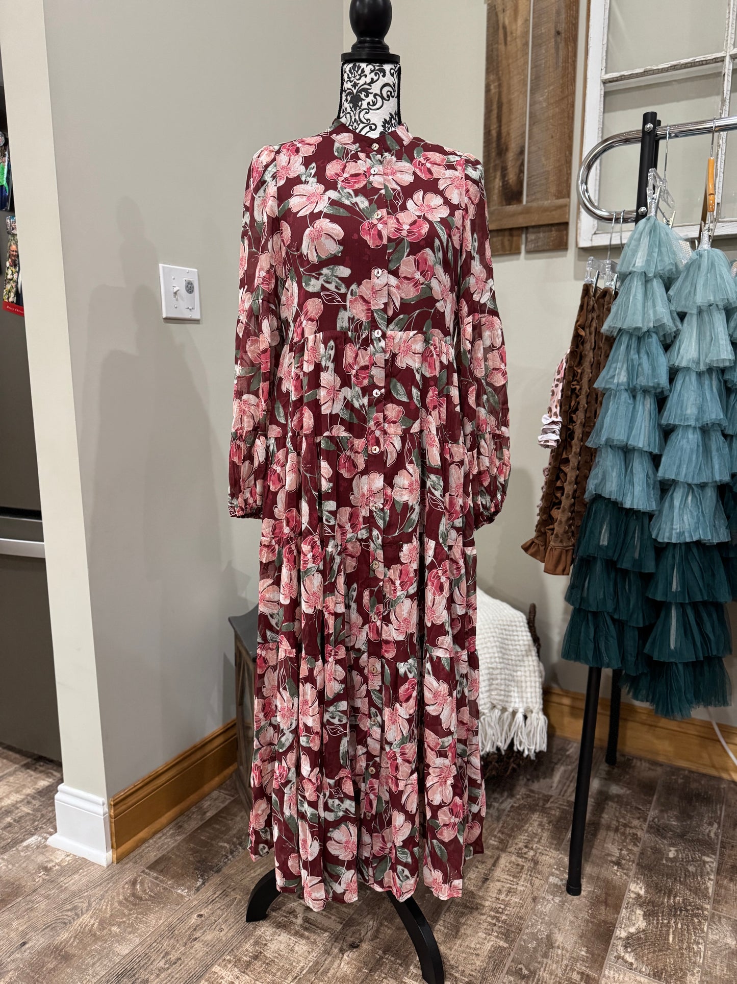 Floral flowy long sleeve button-down maxi dress by Listicle featuring a relaxed fit and vibrant floral pattern.