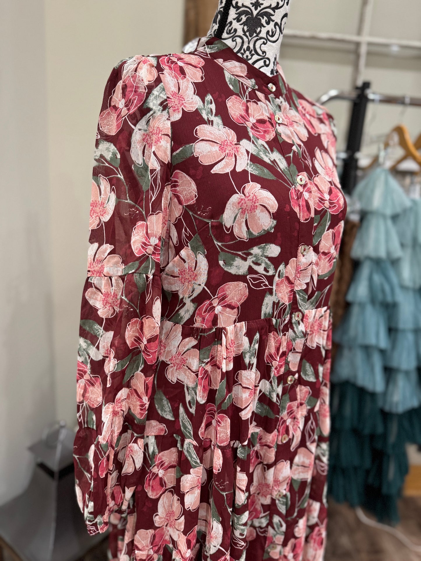 Floral flowy long sleeve button-down maxi dress by Listicle, featuring a relaxed fit and vibrant floral pattern.