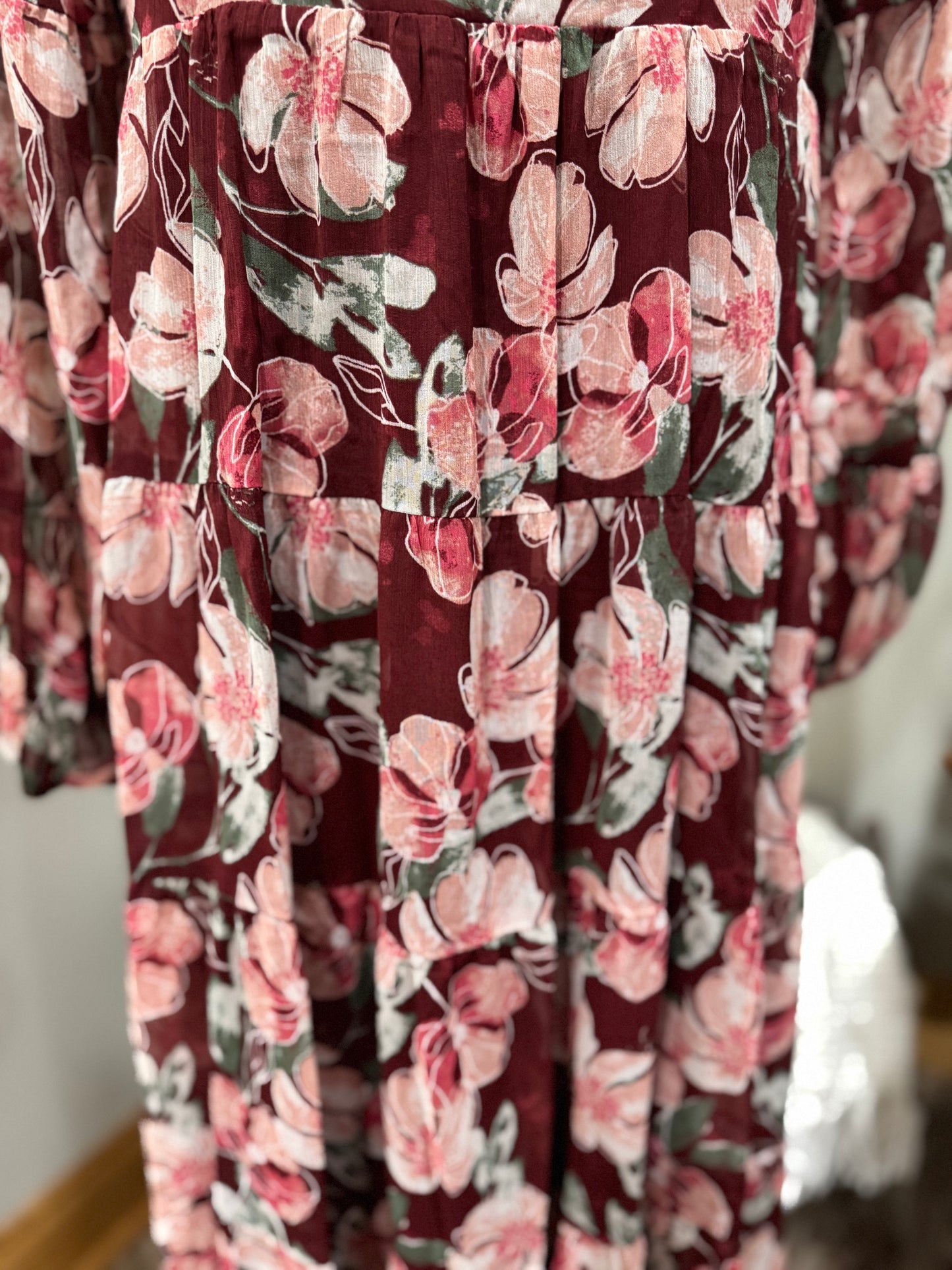 Floral flowy long sleeve button-down maxi dress by Listicle featuring a relaxed fit and vibrant floral pattern.