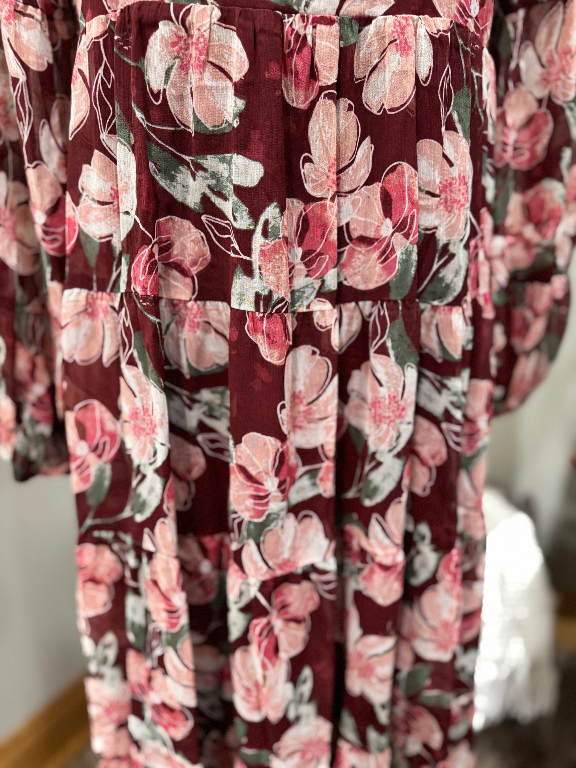 Floral flowy long sleeve button-down maxi dress by Listicle featuring a relaxed fit and vibrant floral pattern.