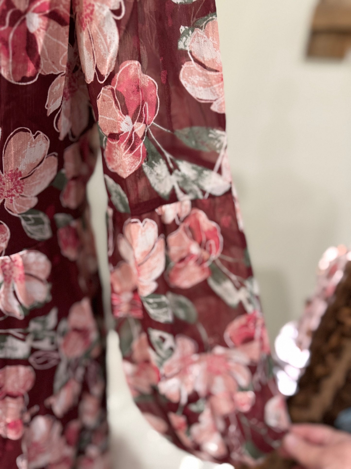 Floral flowy long sleeve button-down maxi dress by Listicle featuring a vibrant floral pattern and relaxed fit.