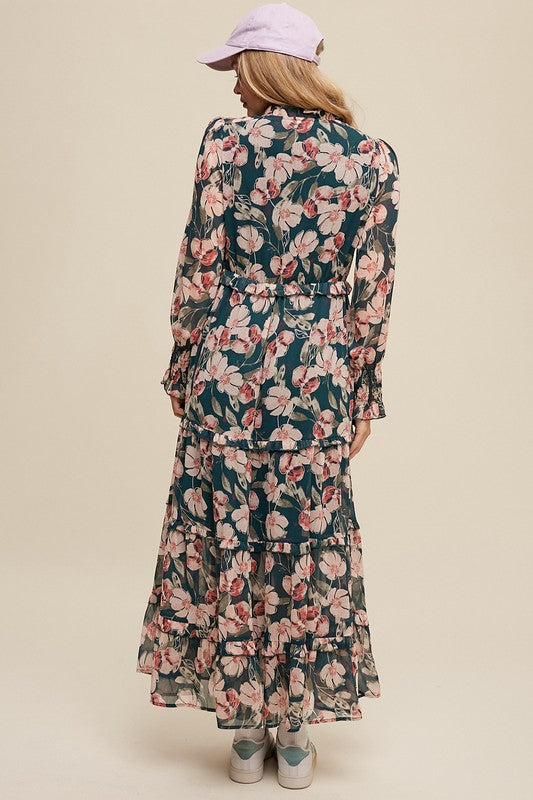 Hunter green floral maxi dress by Listicle featuring V-neck, ruffled tiers, and a flowing silhouette.