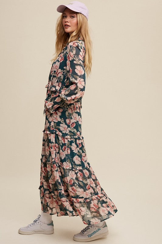 Hunter green floral v-neck maxi dress by Listicle featuring ruffled tiers and a flowing silhouette.