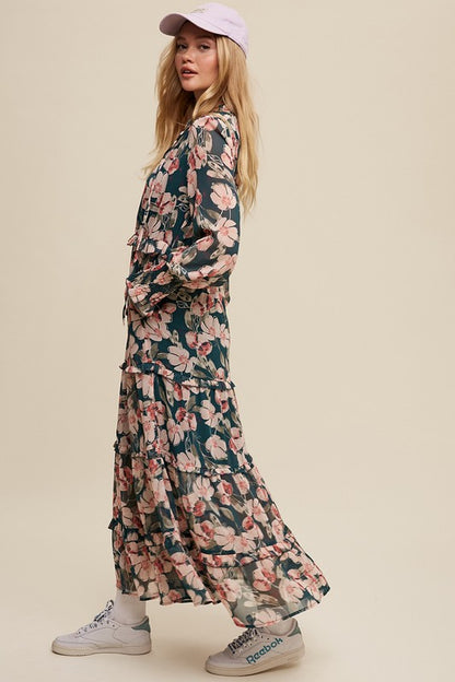 Hunter green floral v-neck maxi dress by Listicle featuring ruffled tiers and a flowing silhouette.