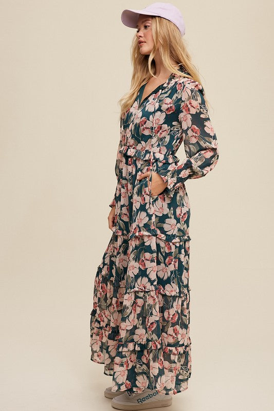 Hunter green floral maxi dress from Listicle featuring a v-neck, ruffled tiers, and a flowing silhouette.