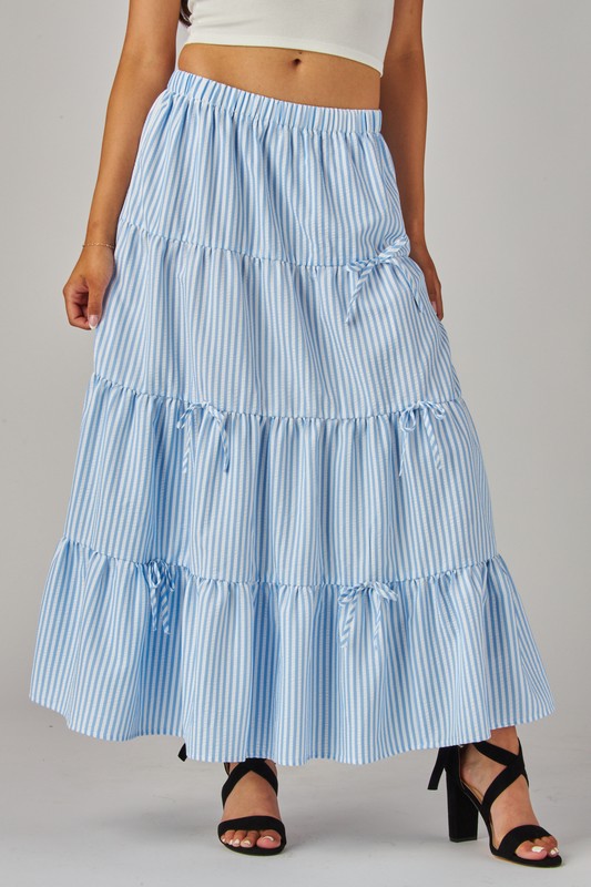 Blue Love Poem maxi skirt with stripes and bows, flowing design and gathered waist for a stylish, casual look.