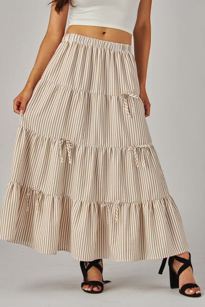 Love Poem khaki maxi skirt with stripes and bows, flowing design, perfect for casual or dressy occasions.