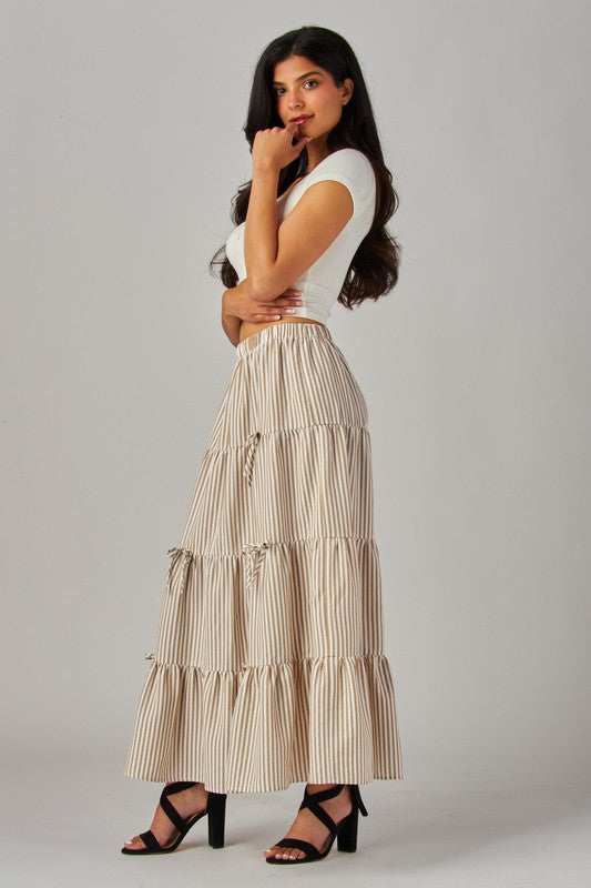 Love Poem khaki maxi skirt with stripes and bows, flowing design, perfect for casual or dressy occasions.
