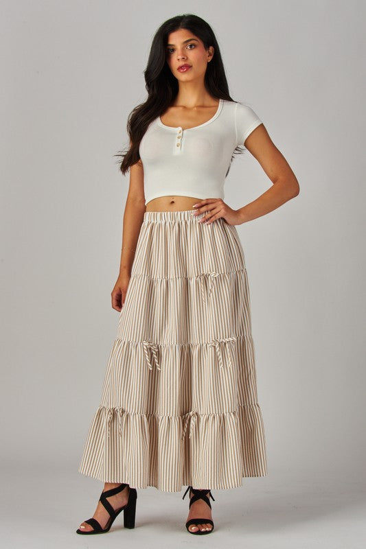 Love Poem khaki maxi skirt with stripes and bows, flowing design perfect for casual or dressy occasions.