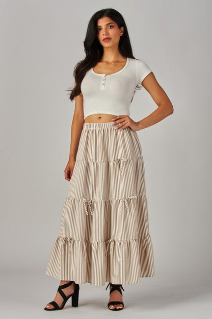 Love Poem khaki maxi skirt with stripes and bows, flowing design perfect for casual or dressy occasions.