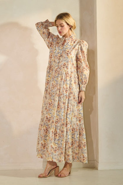 Long sleeve floral maxi dress by Lovelo featuring a flowing silhouette and vibrant floral print, perfect for elegant casual wear.