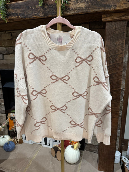 LovLov neutral cream and taupe bow argyle oversized sweater front