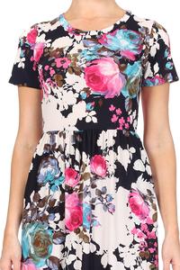 Miss M floral maxi dress with pockets, lightweight fabric, and vibrant floral pattern, perfect for summer or casual occasions.