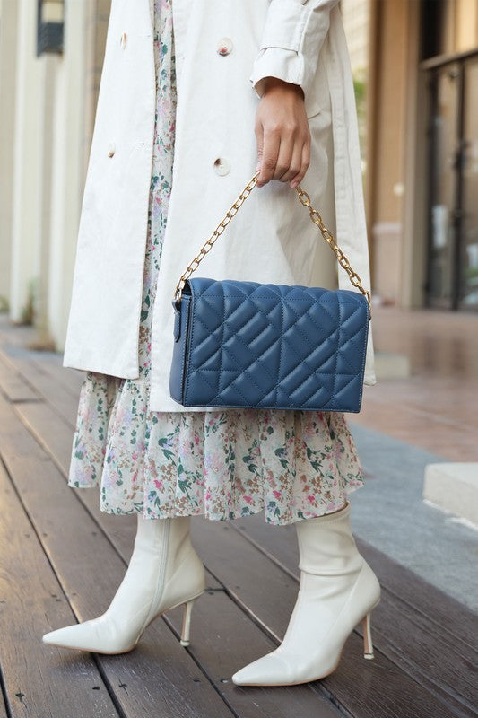 Taupe MKF Ursula crossbody bag by Mia K, featuring a sleek design with adjustable strap and stylish hardware.