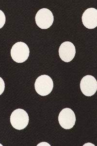 Black blazer with white polka dots from MOA Collection, tailored fit, shown on a model with lapels and button closure.