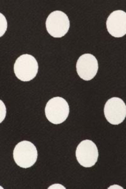 Black blazer with white polka dots from MOA Collection, tailored fit, shown on a model with lapels and button closure.