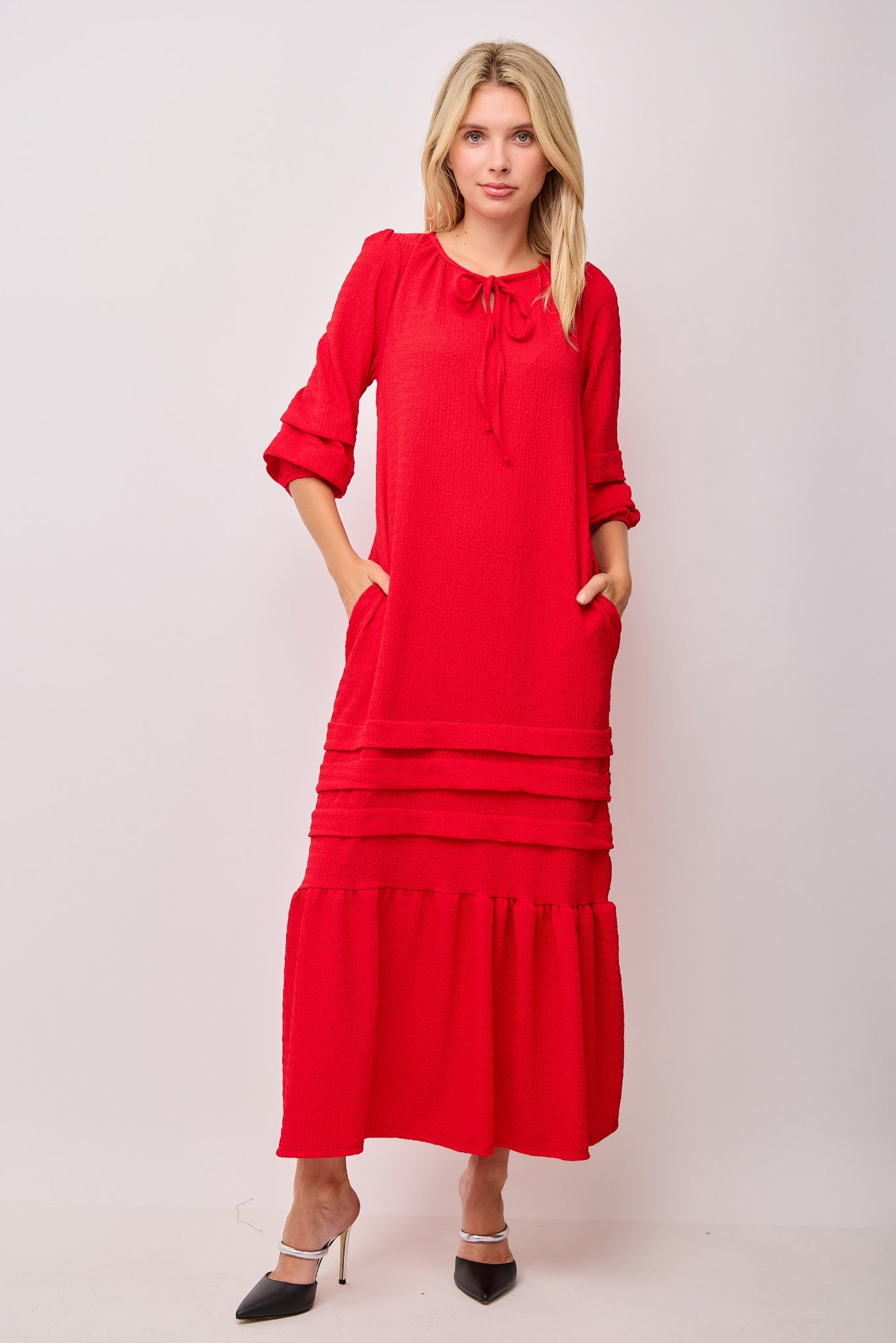 Textured beige maxi dress with pin tuck details and pockets by Modest and Devoted Designs, shown in multiple colors.