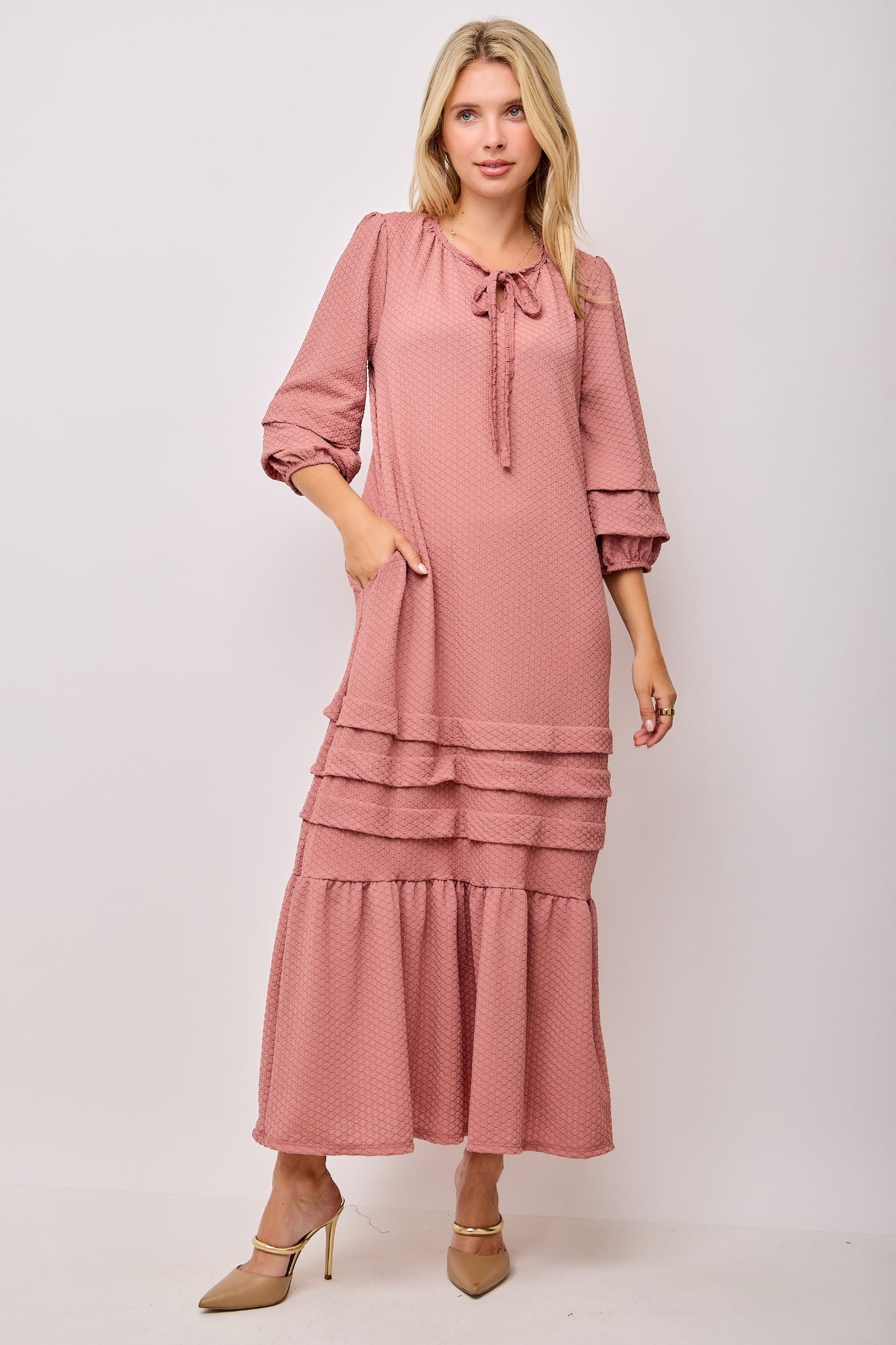 Beige textured pin tuck maxi dress with pockets by Modest and Devoted Designs, featuring a flowy silhouette and stylish detailing.