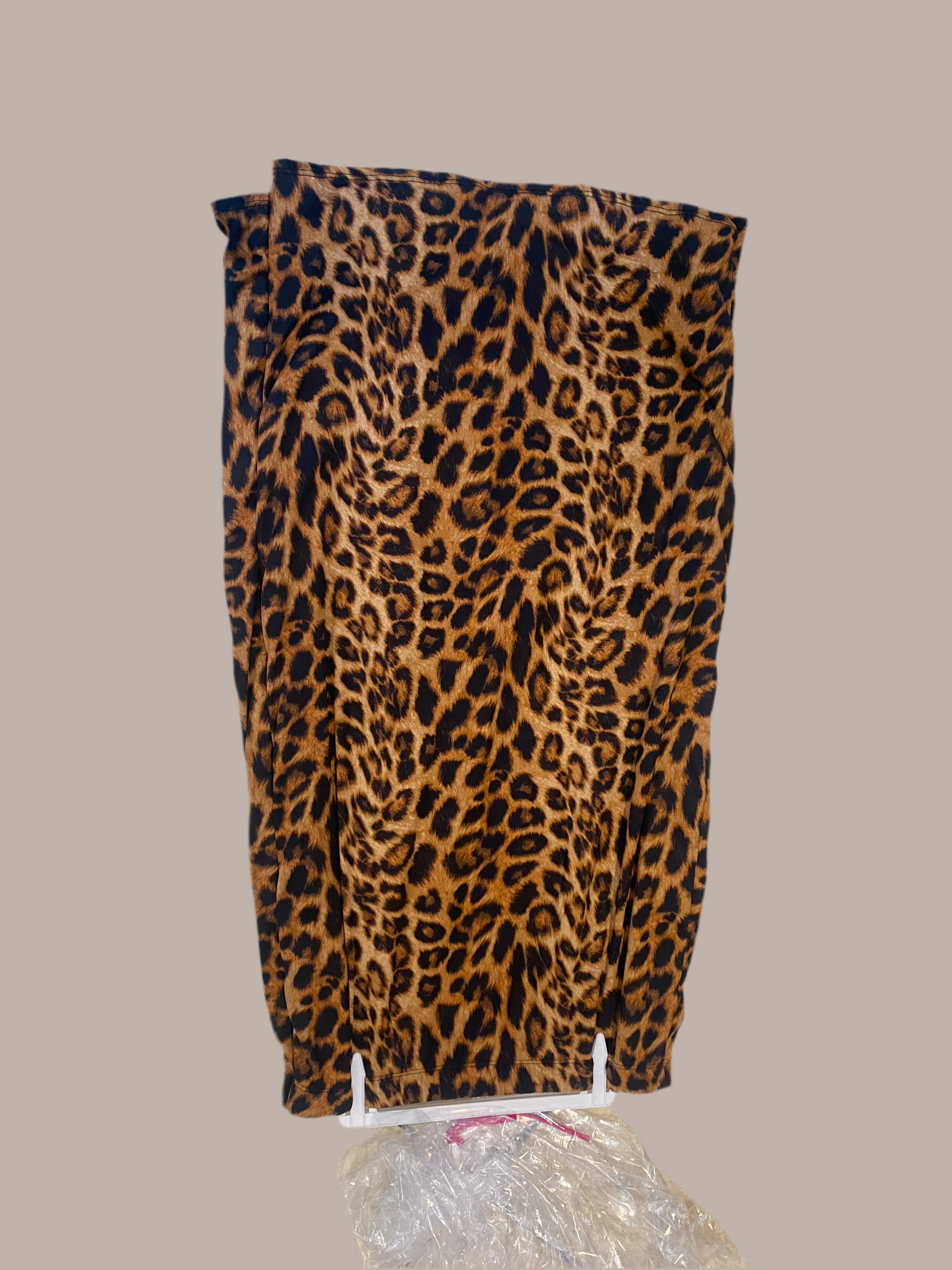 Leopard print fully lined elastic waist pencil skirt by Modest and Devoted Designs, sleek and stylish for office or casual wear.