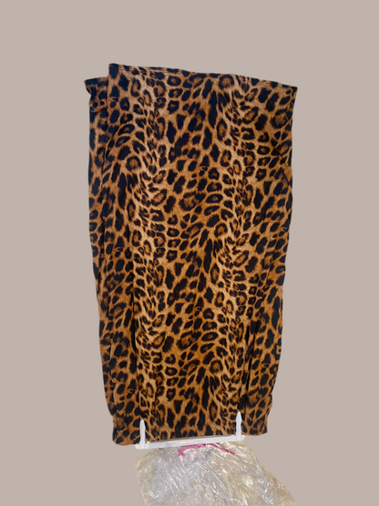 Leopard print pencil skirt from ModestAndDevoted with fully lined interior and elastic waistband, designed for a fitted silhouette.