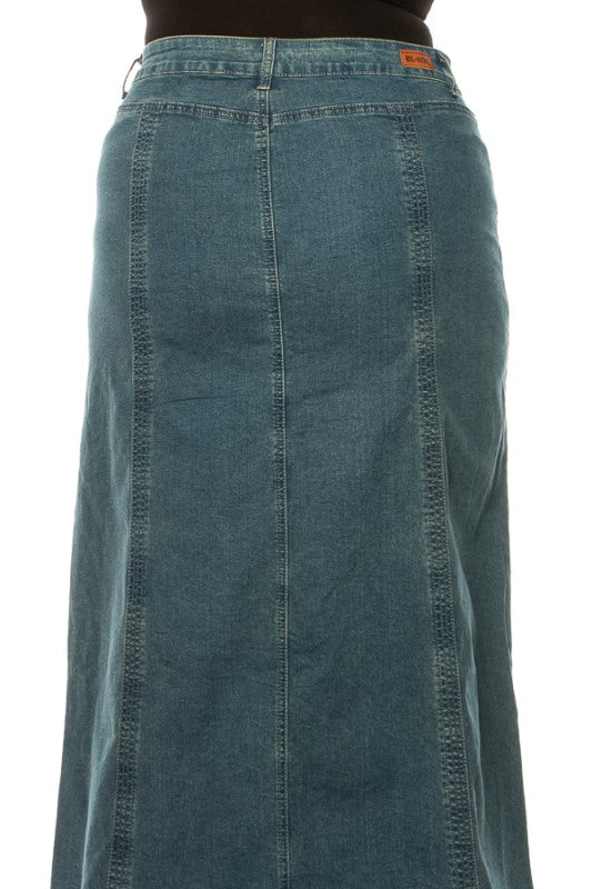ModestAndDevoted BeGirl Plus Stitch Style Denim Maxi dress hanging on a rack with detailed stitch design and flowy fabric.