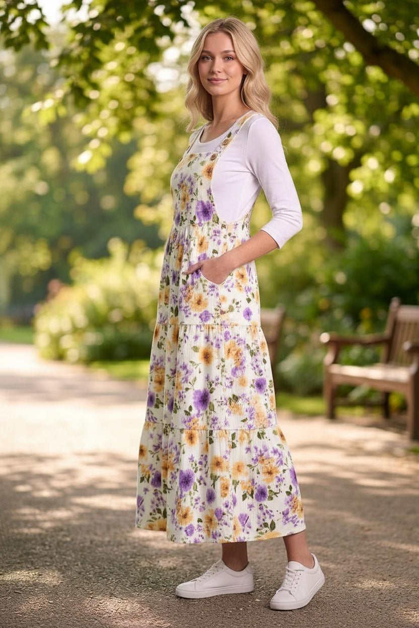 Women's plus floral print overall maxi dress by ModestAndDevoted, featuring a vibrant floral pattern and flowing silhouette.