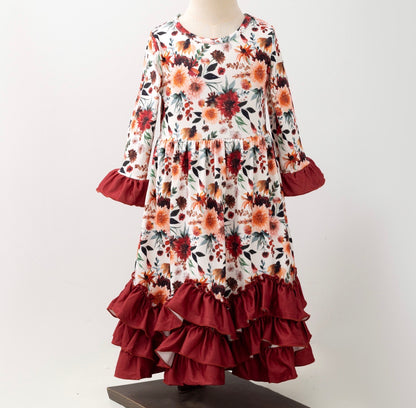 Girls Maxi Mahogany Bouquet Long Sleeve Ruffle Dress by ModestAndDevoted, featuring a floral pattern and ruffled sleeves.