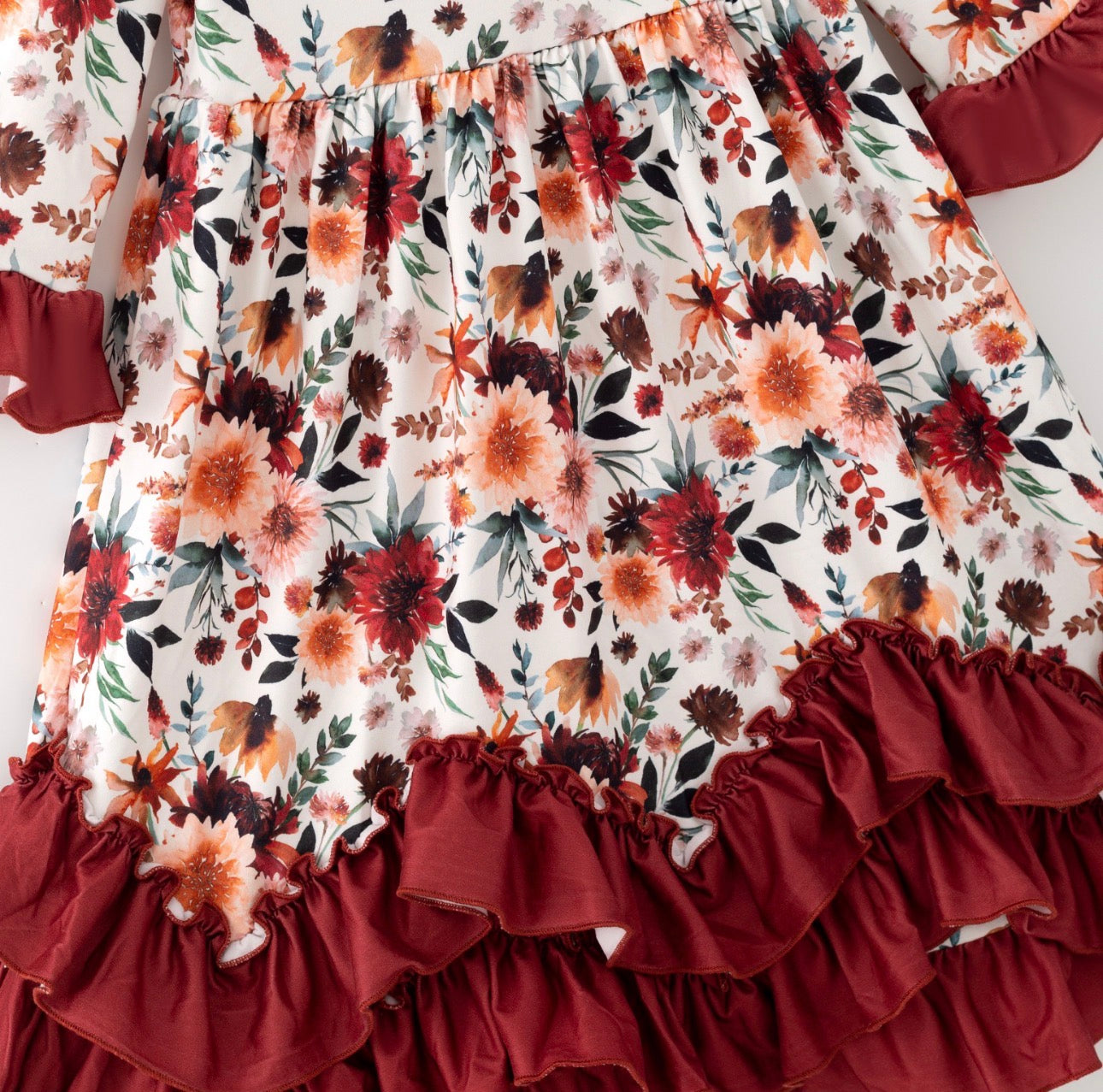 Girls Maxi Mahogany Bouquet Ruffle Dress with Long Sleeves by ModestAndDevoted, featuring a floral pattern and elegant ruffle details.