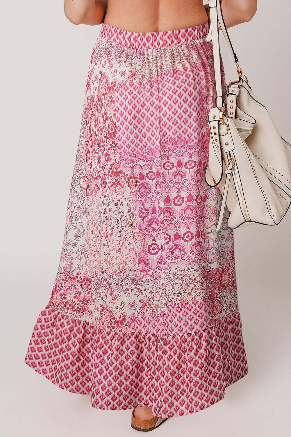 Red boho pattern print maxi dress with tassel drawstring and high waist, from ModestAndDevoted, shown as a flowing skirt.