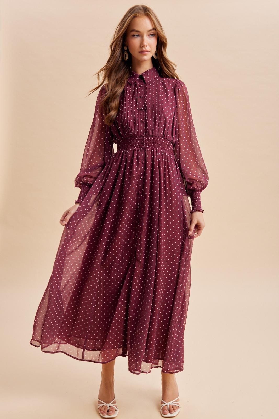 Effortlessly elegant polka dot maxi dress by ModestAndDevoted with pintuck pleats and a flowing silhouette.