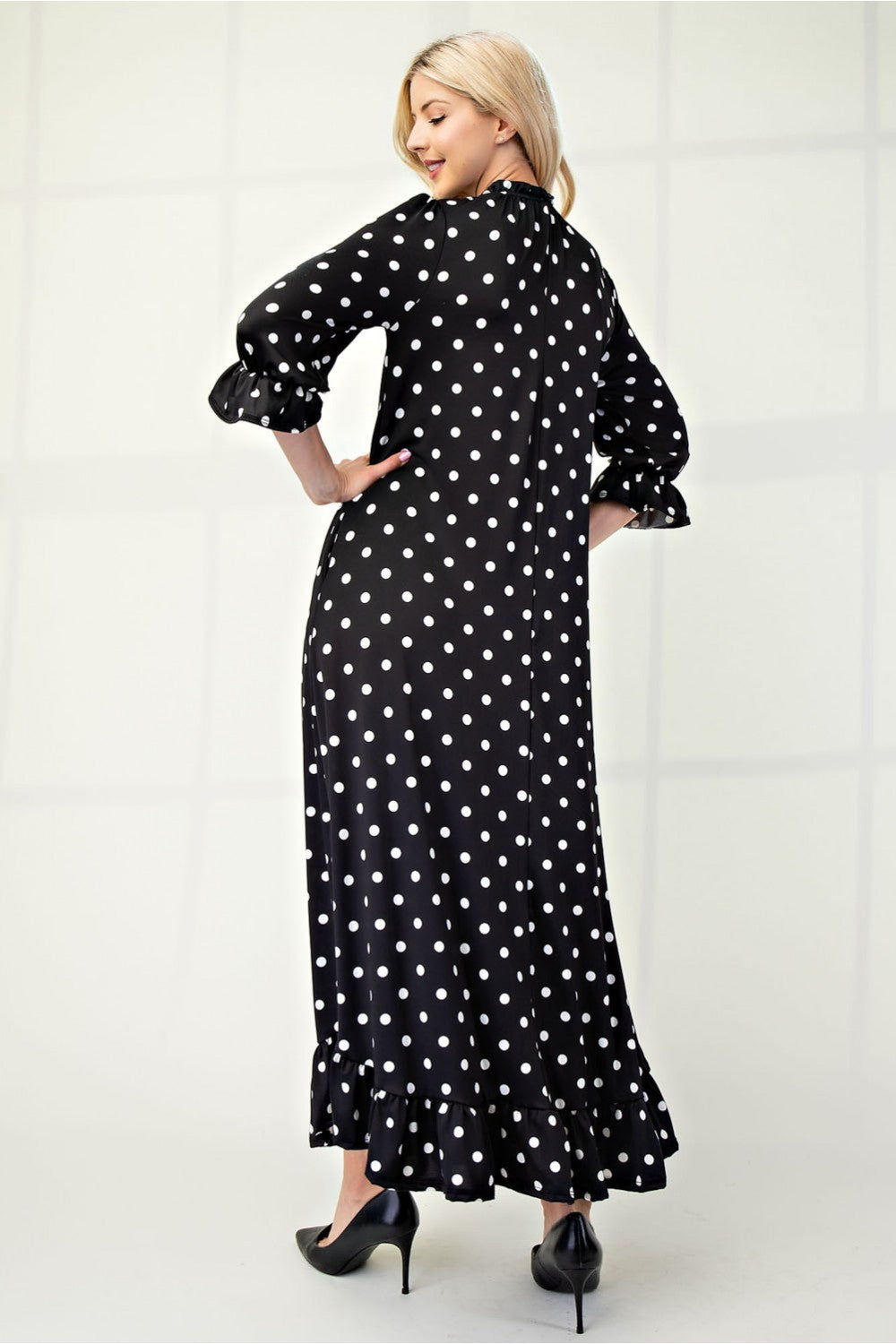Polka dot 3/4 sleeve ruffle trim dress by ModestAndDevoted, plus size, featuring a classic pattern and feminine ruffle details.