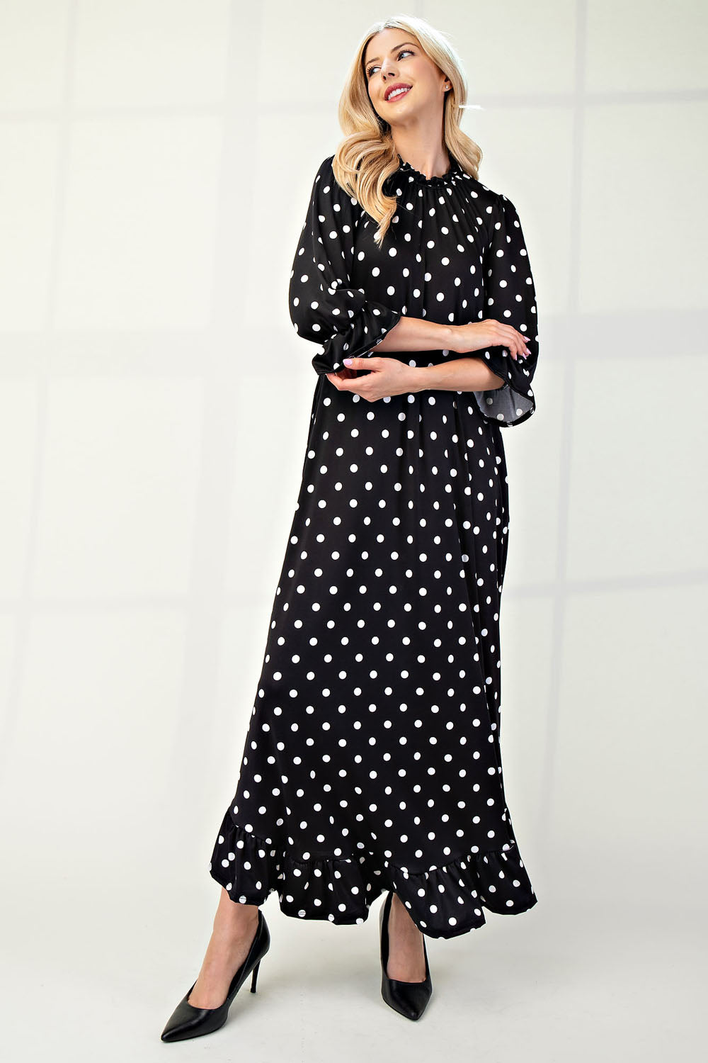 Polka dot 3/4 sleeve ruffle trim dress by ModestAndDevoted, featuring a flattering fit and stylish details for plus size.