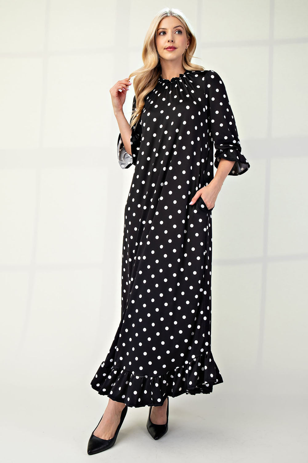 Polka dot 3/4 sleeve ruffle trim dress by ModestAndDevoted, plus size, featuring a feminine ruffle detail and classic design.
