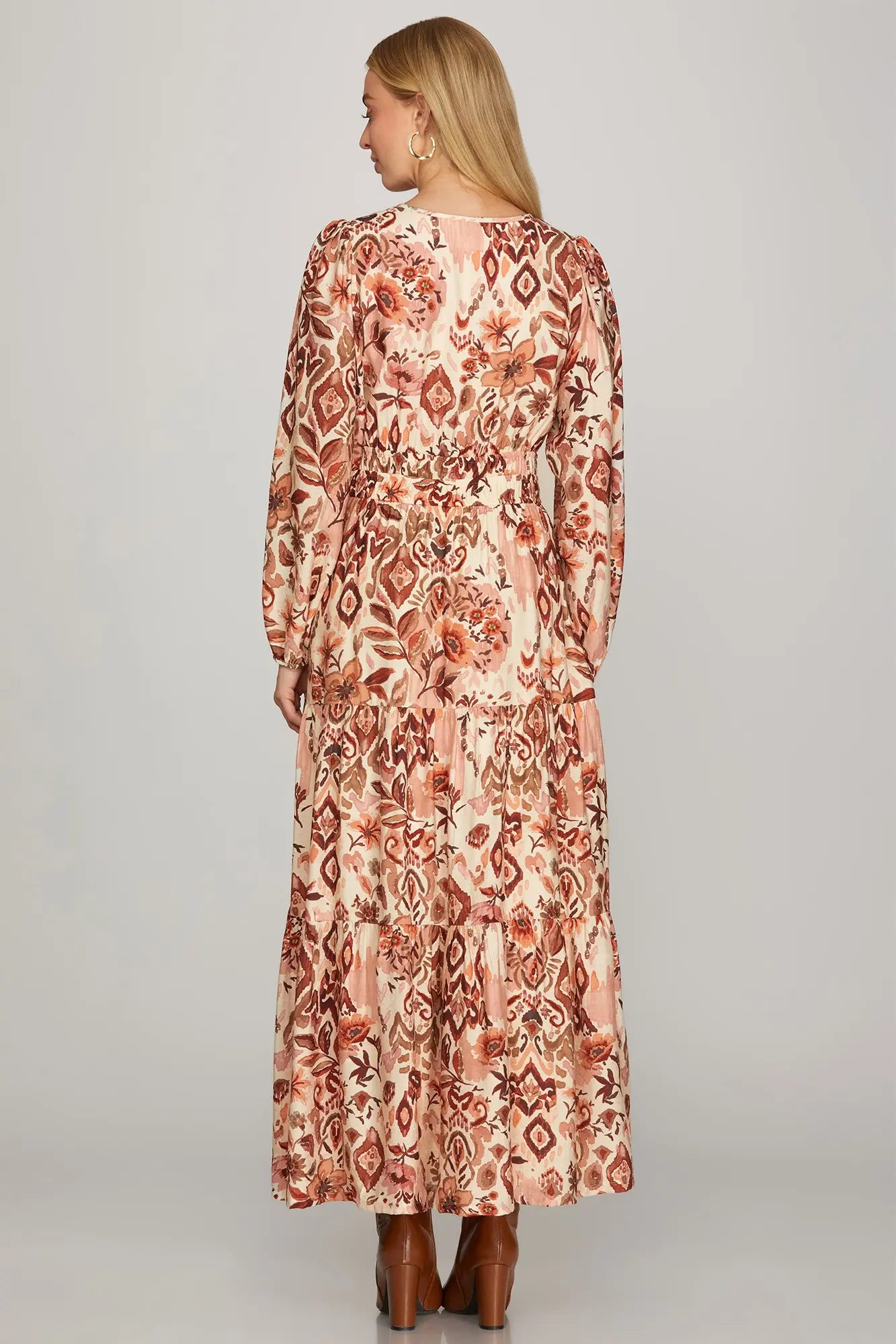 Long sleeve boho fall maxi dress by ModestAndDevoted featuring an abstract floral pattern in brown and olive.