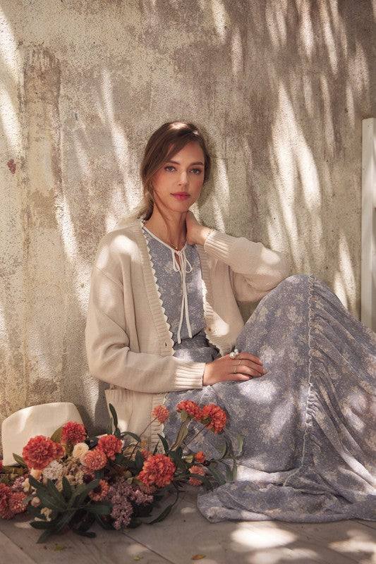 Dusty blue Romantic Flora Maxi Dress by ModestAndDevoted featuring a smocked waist and flowing fabric, perfect for elegant occasions.