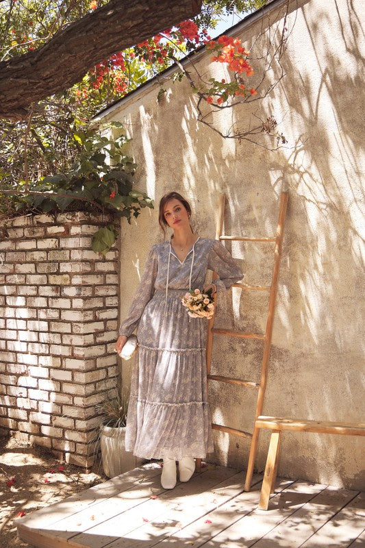 Dusty blue Romantic Flora Maxi Dress by ModestAndDevoted featuring a smocked waist and floral design, flowing fabric and elegant style.
