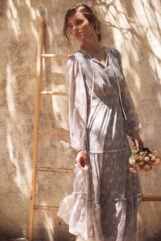 Dusty blue Romantic Flora Maxi Dress with smocked waist by ModestAndDevoted, featuring flowy fabric and floral pattern.