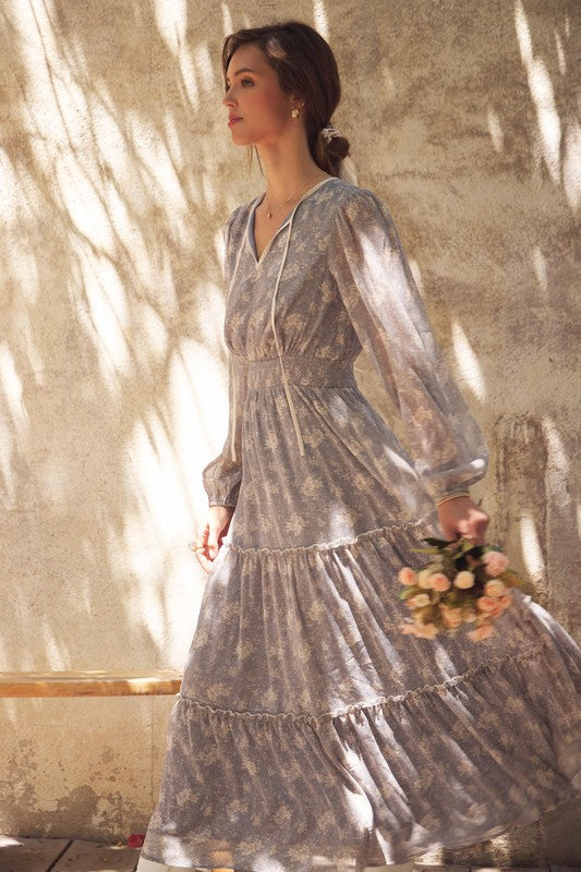 Dusty blue Romantic Flora Maxi Dress by ModestAndDevoted featuring a smocked waist and flowing fabric, perfect for elegant occasions.