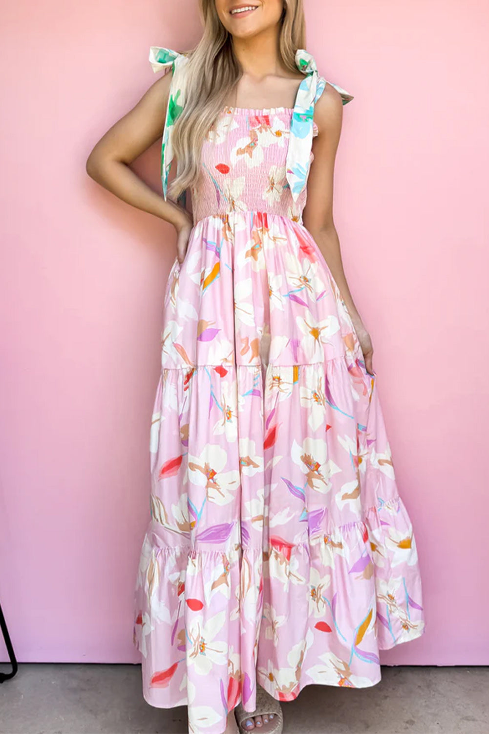 Pink floral print maxi dress with knotted shoulders and smocked bodice by ModestAndDevoted, featuring a flowy polyester fabric.