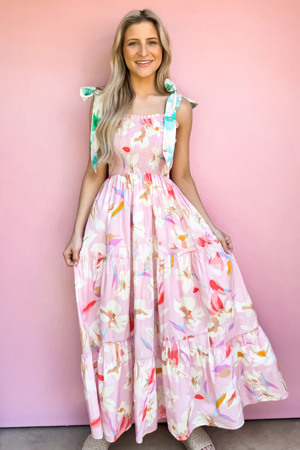 Pink floral print maxi dress with knotted shoulders and smocked bodice by ModestAndDevoted, made of polyester fabric.