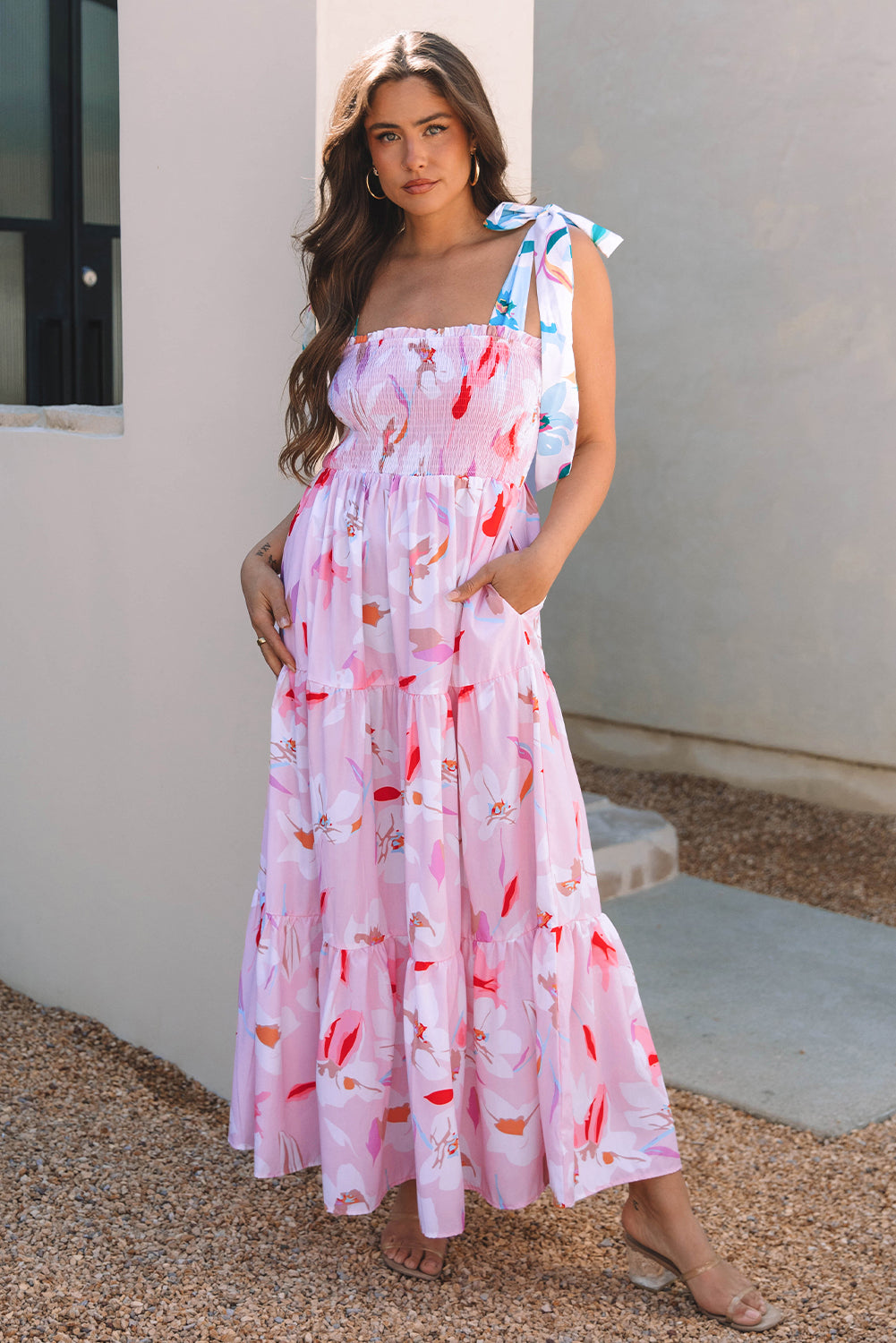 Pink floral print maxi dress with knotted shoulder straps and smocked bodice by ModestAndDevoted, perfect for casual or special occasions.