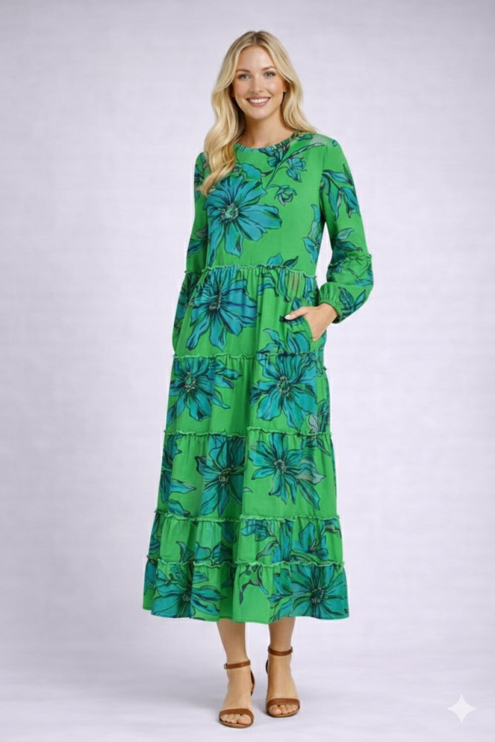 Green ModestAndDevoted floral long sleeve tiered maxi dress, flowing design with a modest, elegant style.