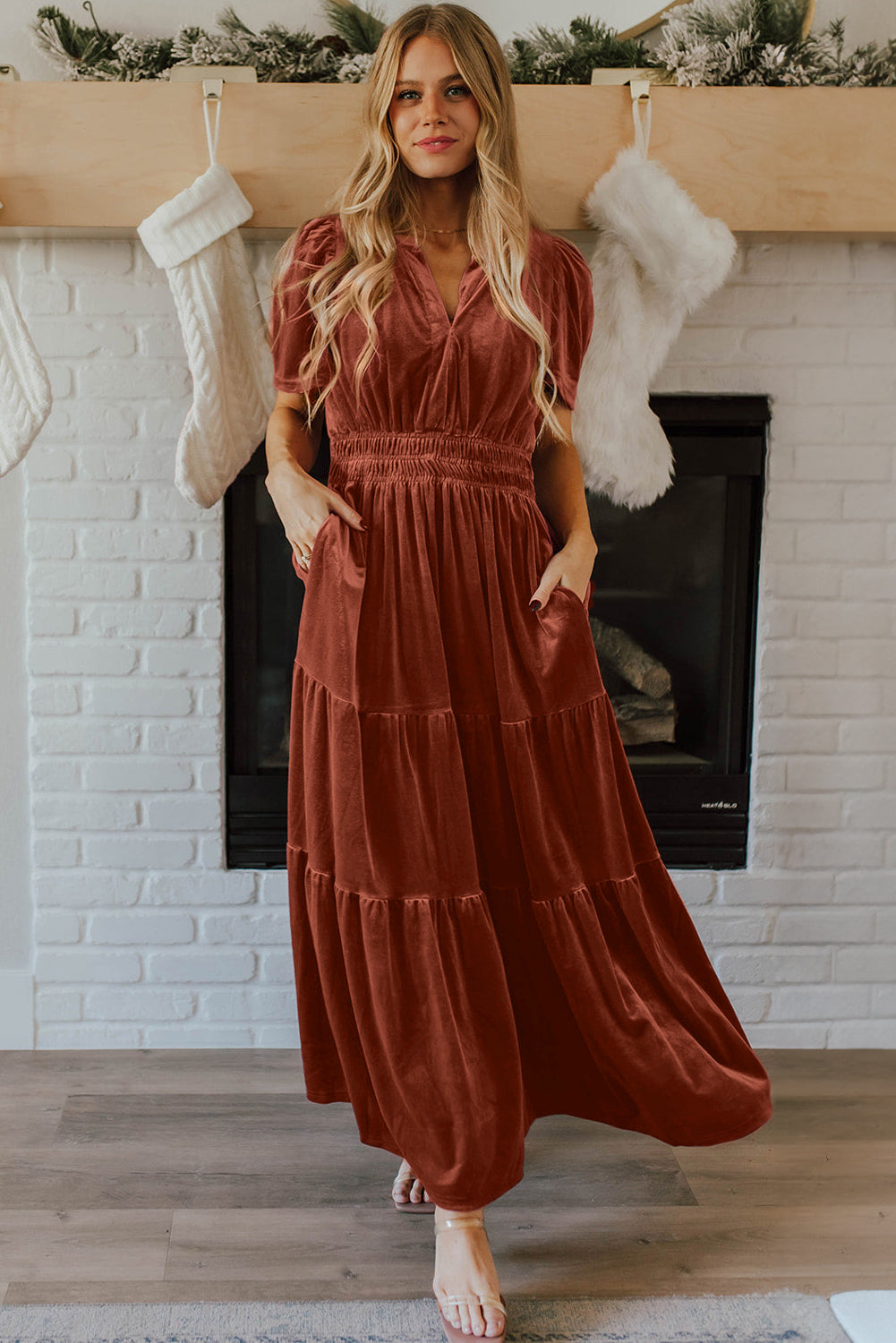 Red Dahlia velvet maxi dress by ModestAndDevoted featuring short sleeves, shirred waist, and tiered skirt in a rich red color.