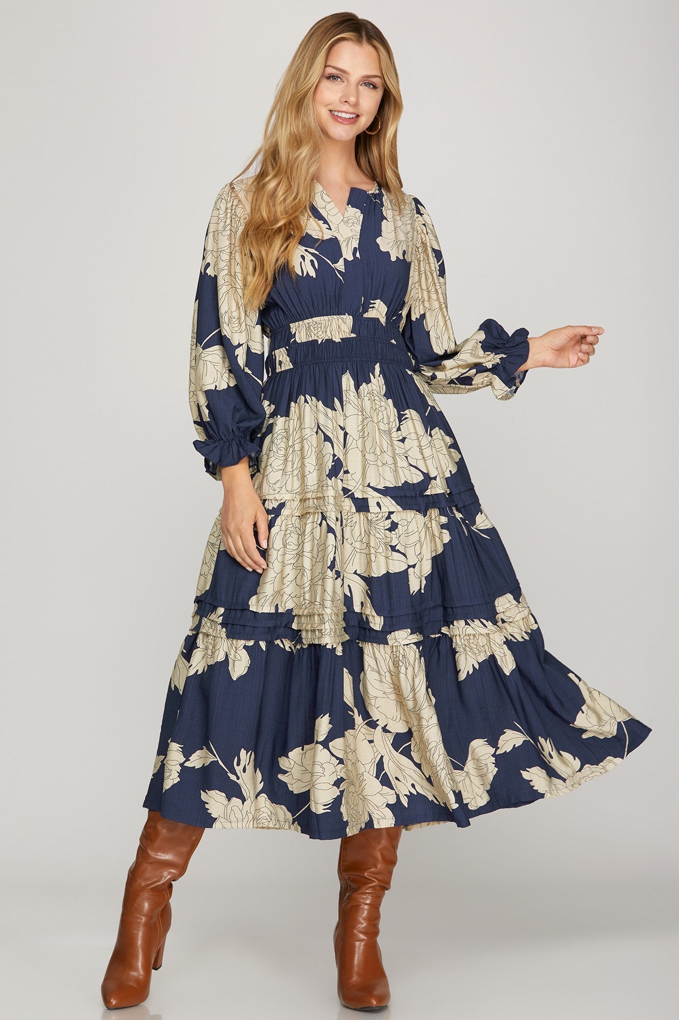 Navy pintuck tiered floral print maxi dress by ModestAndDevoted, featuring a flowy silhouette and elegant floral pattern.