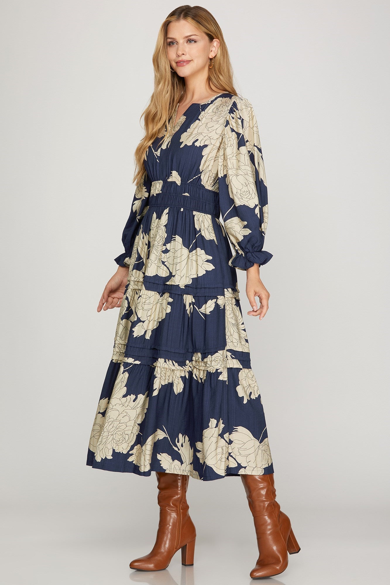 Navy Pintuck Tiered Floral Print Maxi Dress by ModestAndDevoted, featuring feminine floral pattern and flowing tiered design.
