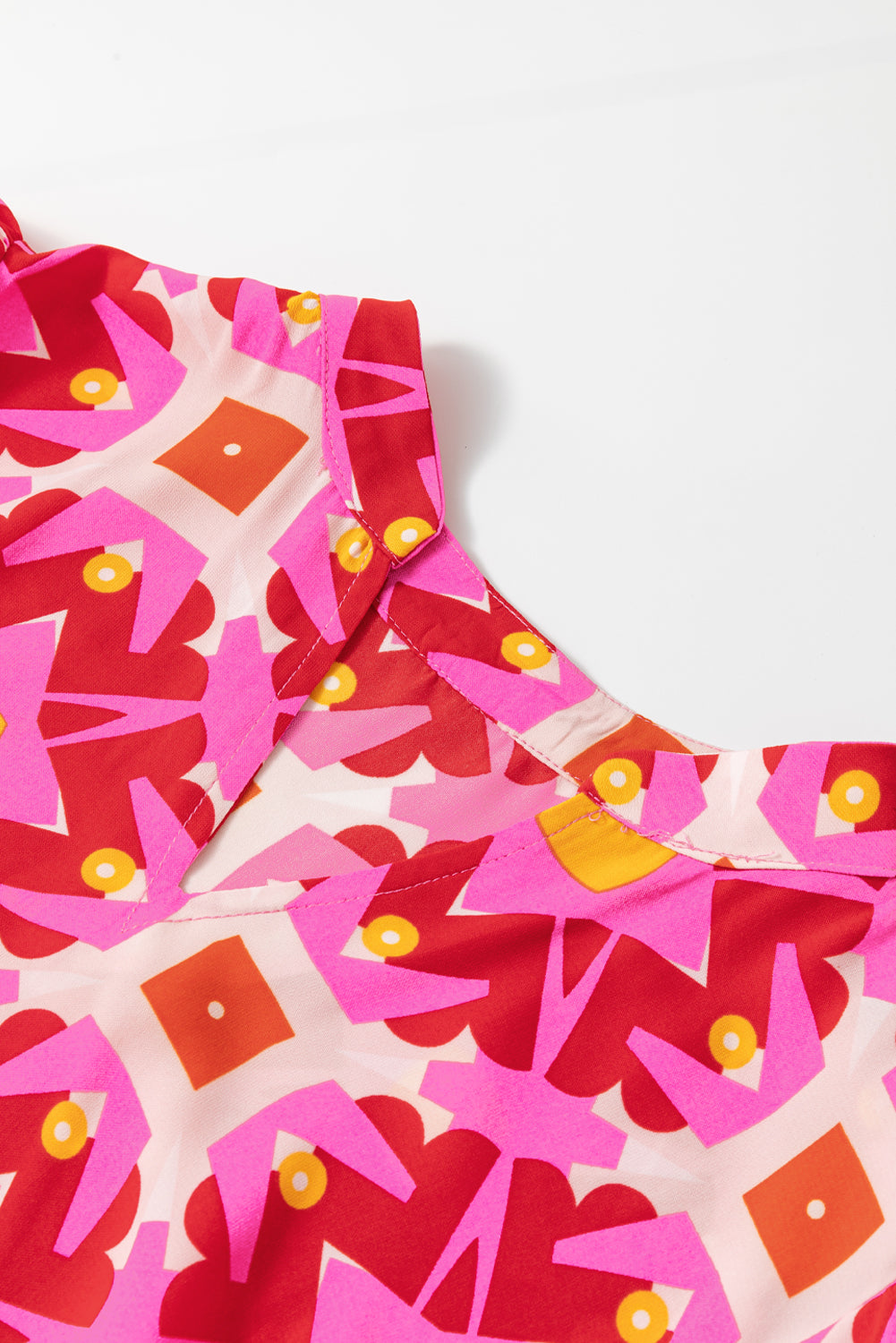 Strawberry pink geo print V-neck maxi dress by ModestAndDevoted, featuring a flowy polyester fabric and elegant design.