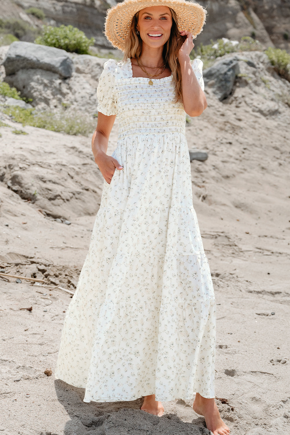 White floral maxi dress with frilly shirred bodice and tiered design from ModestAndDevoted, perfect for elegant summer occasions.