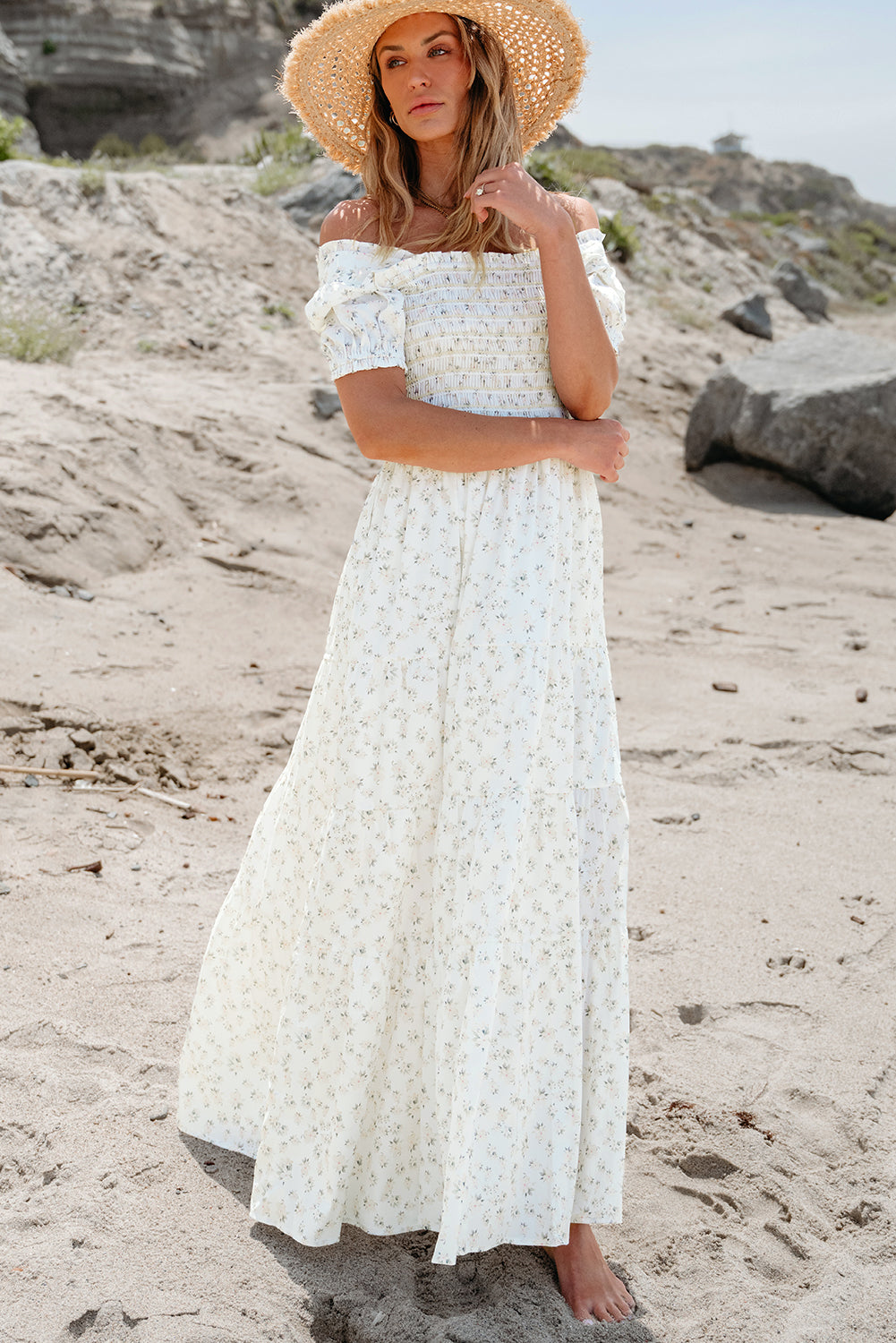 White floral maxi dress by ModestAndDevoted featuring a frilly shirred bodice and tiered skirt, perfect for elegant summer occasions.