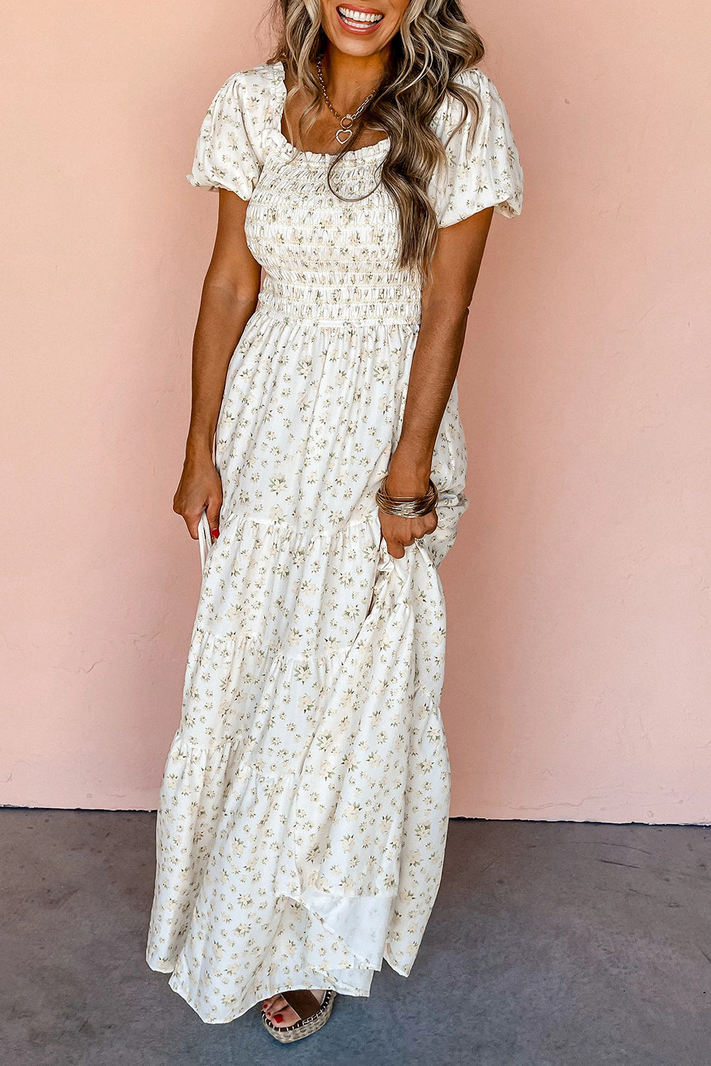 White floral maxi dress with frilly shirred bodice and tiered skirt by ModestAndDevoted, perfect for elegant summer wear.