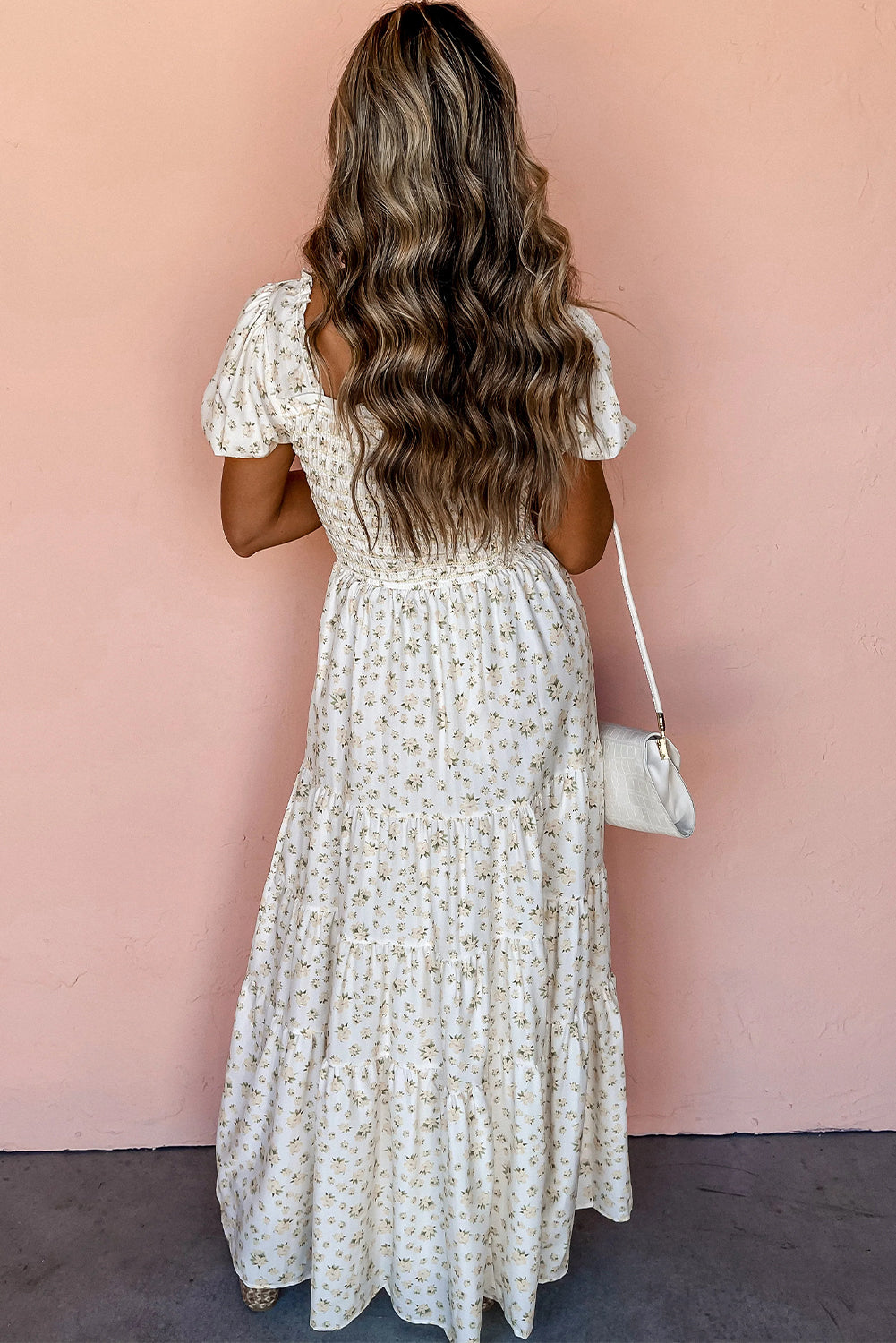White floral maxi dress with frilly shirred bodice and tiered skirt from ModestAndDevoted, perfect for elegant summer wear.